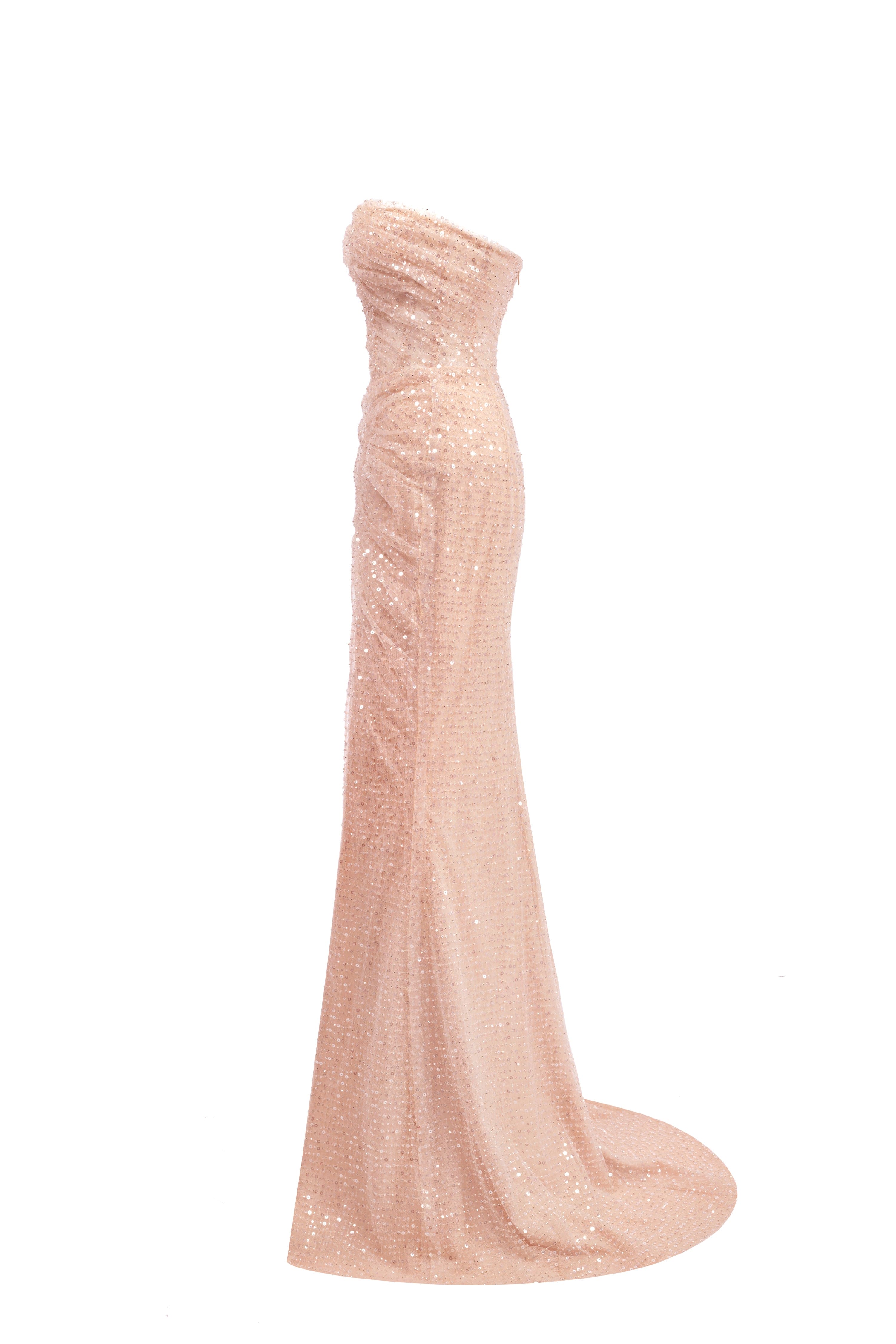 Сукня золотого кольору вкрита блискучими лелітками