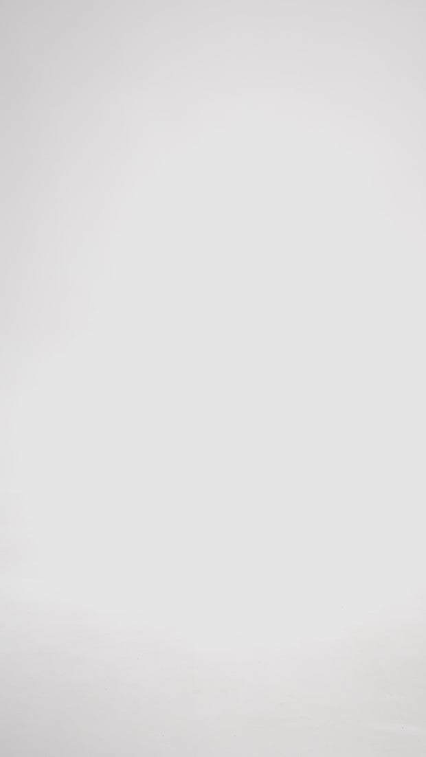 Приталена нюдова сукня міні з бантиками